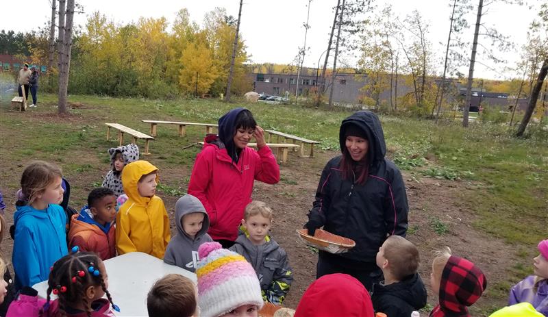 Nooshkaachige - Student Helpers Teaching About Winnowing